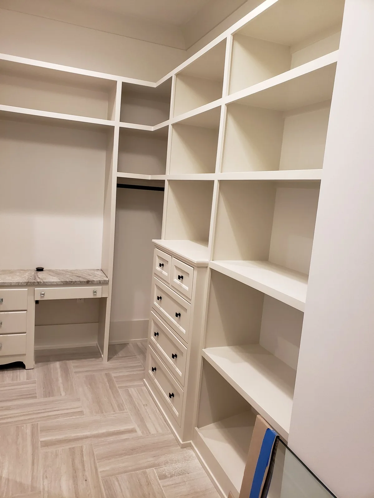Walk-in closet cabinetry during final finishing.