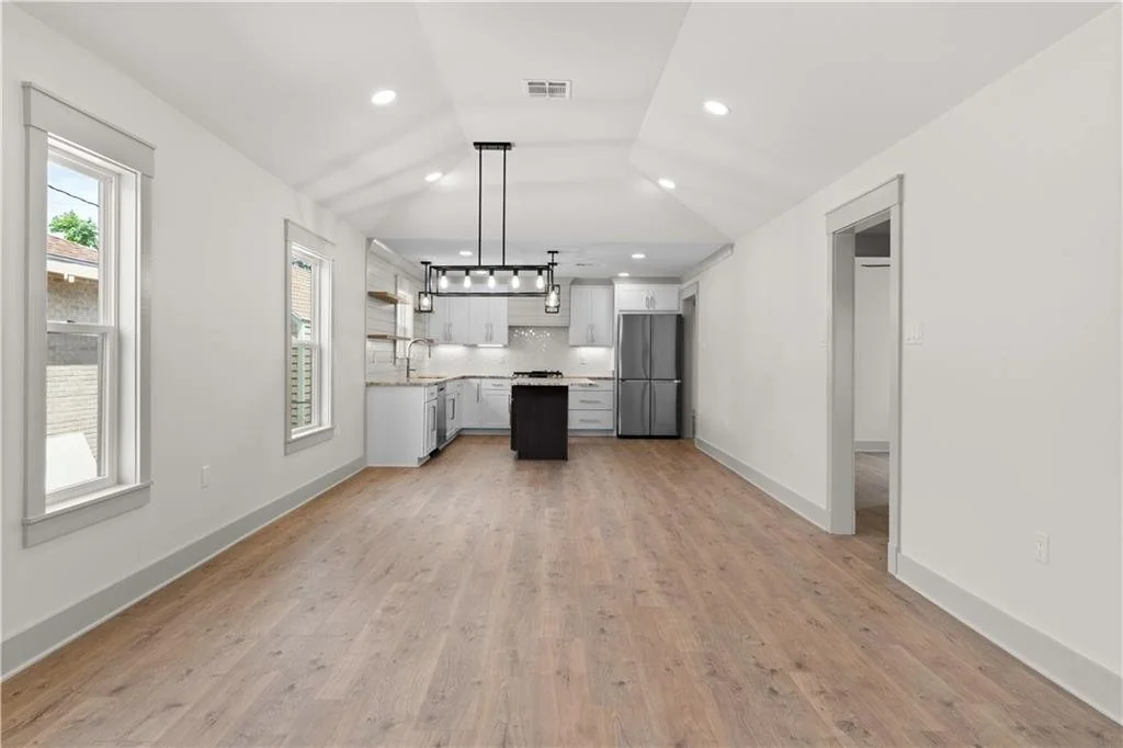 Renovated living room with an open connection to the kitchen.