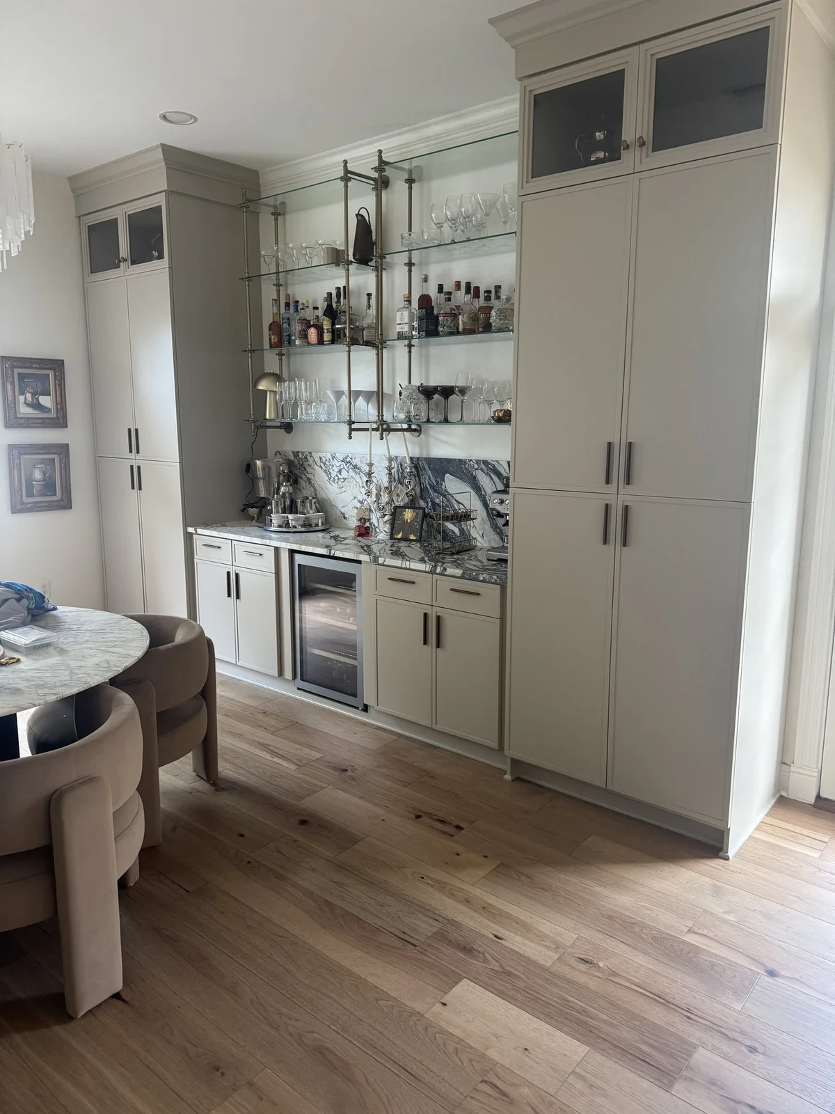 After: replacement flooring beside the retained dining-area cabinetry.