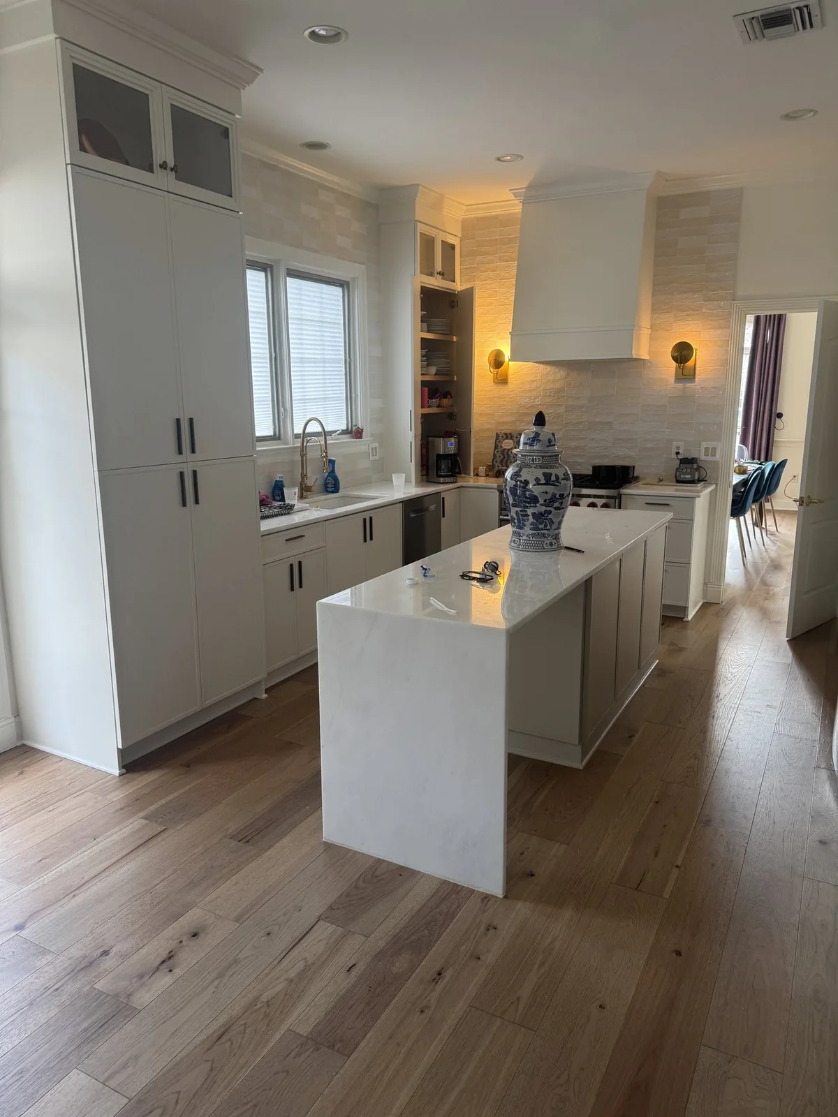 After: replacement flooring around the existing kitchen island and cabinetry, which remained intact.