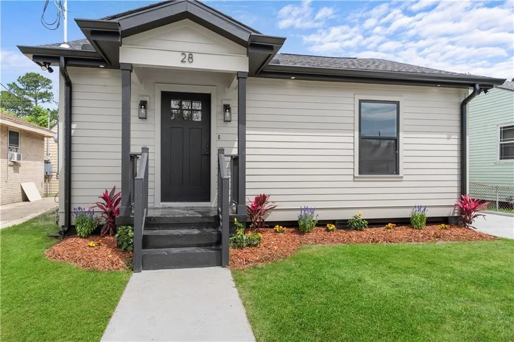 Completed front exterior after the whole-home renovation.