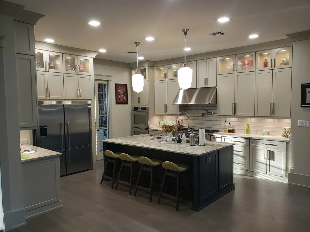 Main kitchen with an island and full-height cabinetry.