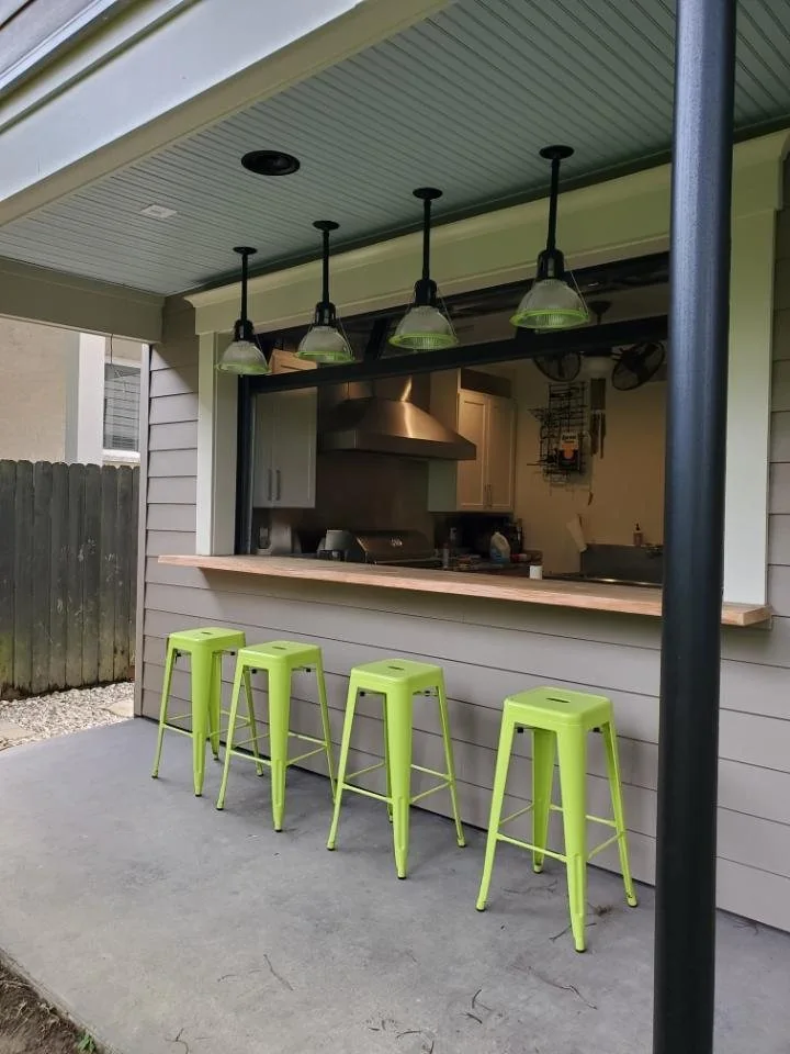 Indoor-outdoor kitchen and covered seating counter.